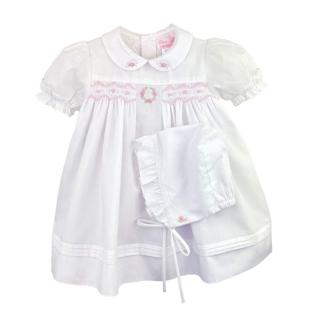 White dress with pink flowered smocking