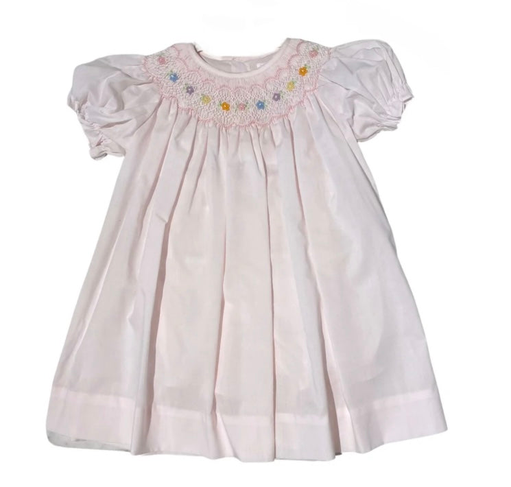 Pink smocked bishop dress with colorful flowers