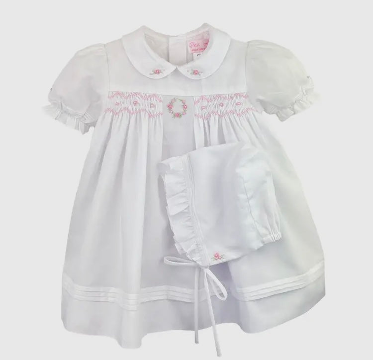 White dress with pink flowered smocking