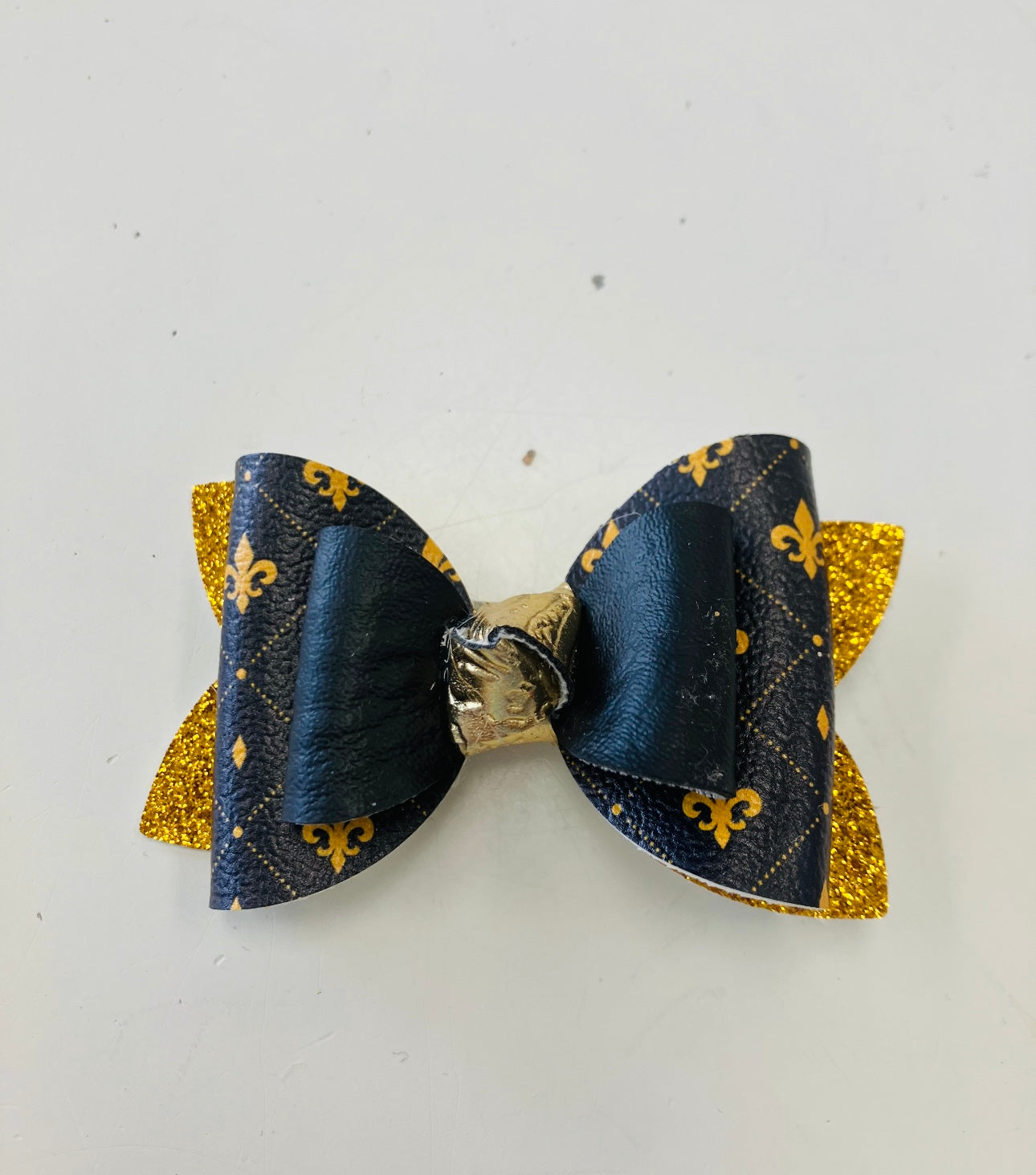 small bow with black and yellow gold fleur de lis pattern