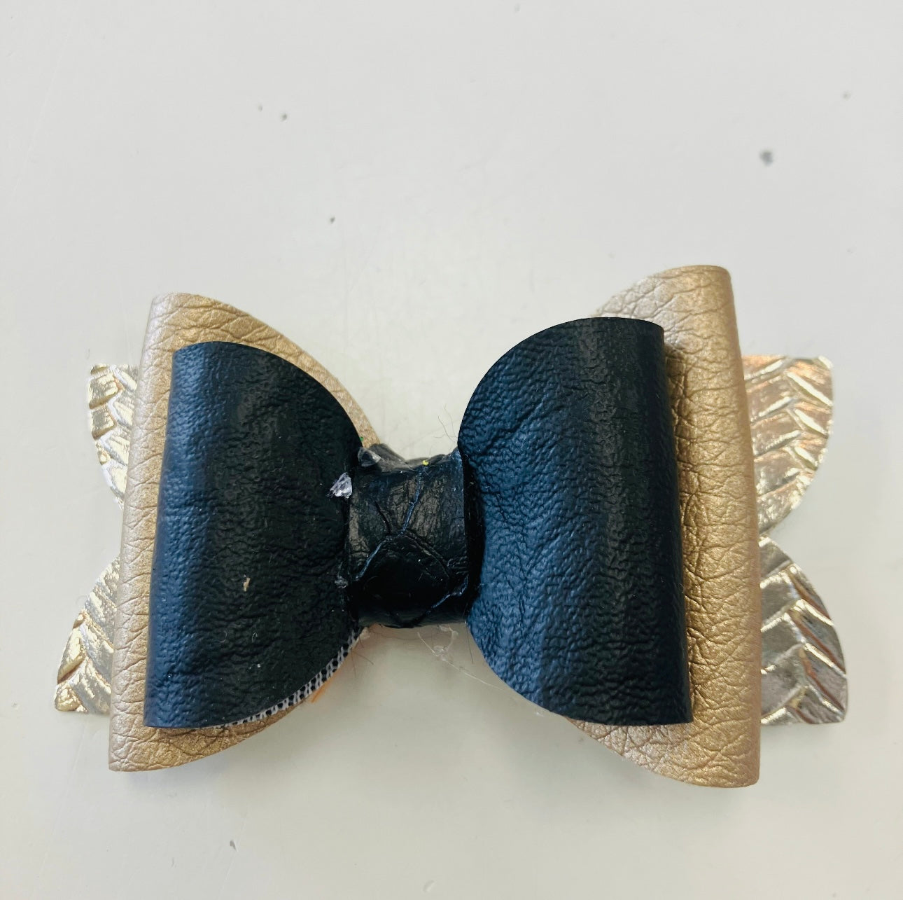 small black and gold snake skin pattern bow