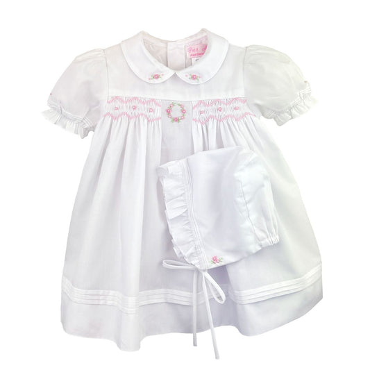 White dress with pink flowered smocking