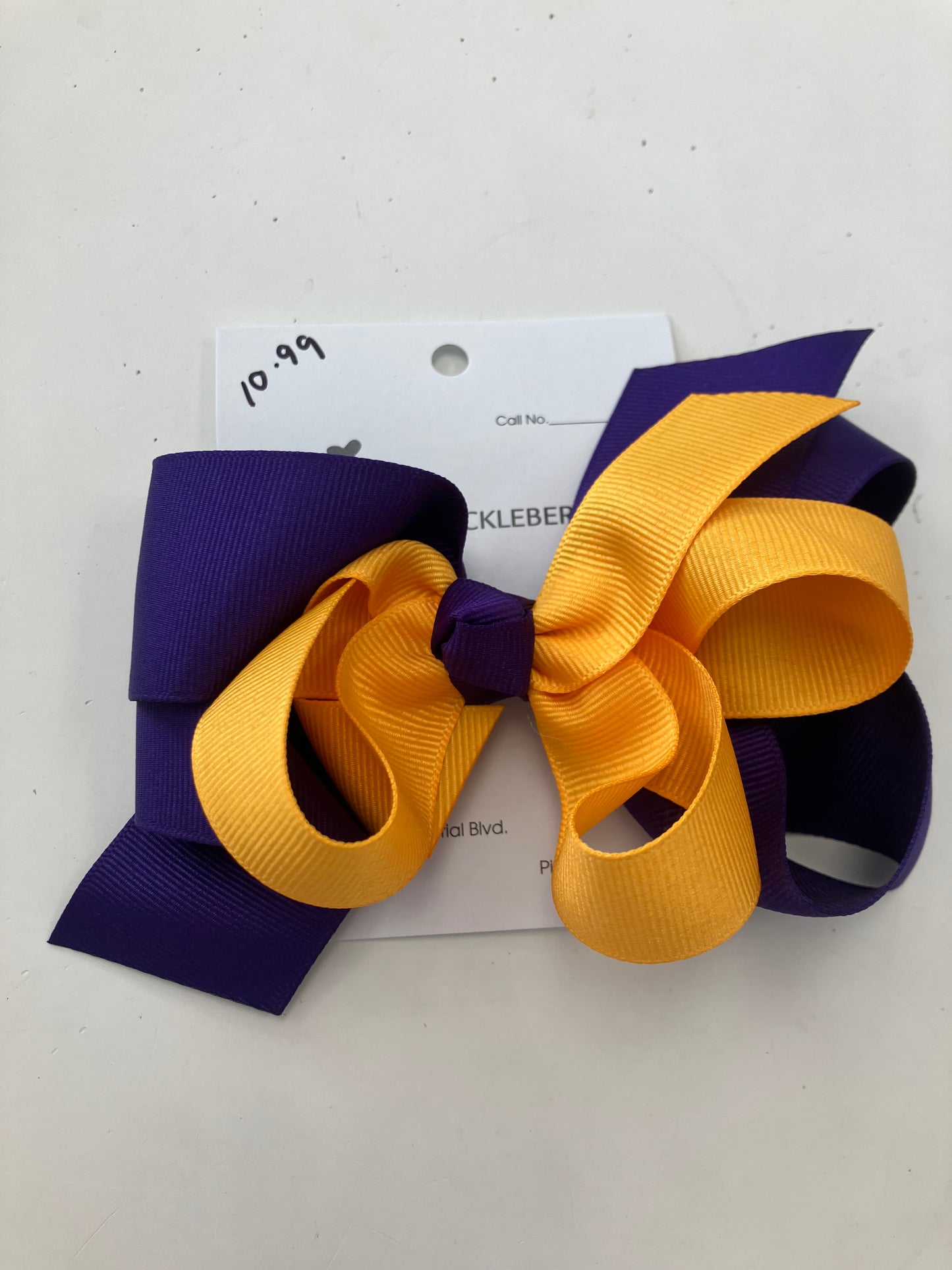 Purple and gold bow