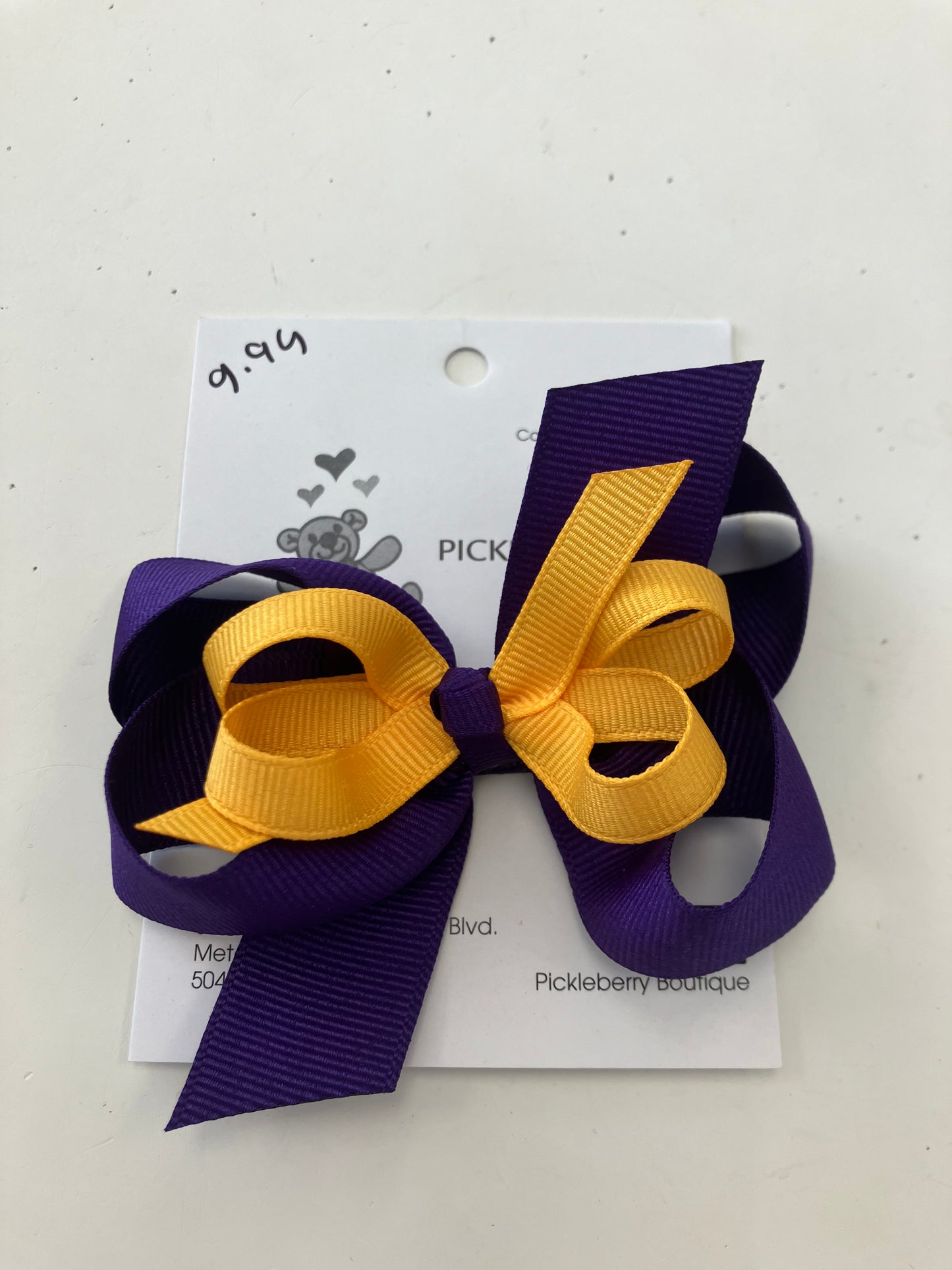 Purple and gold bow