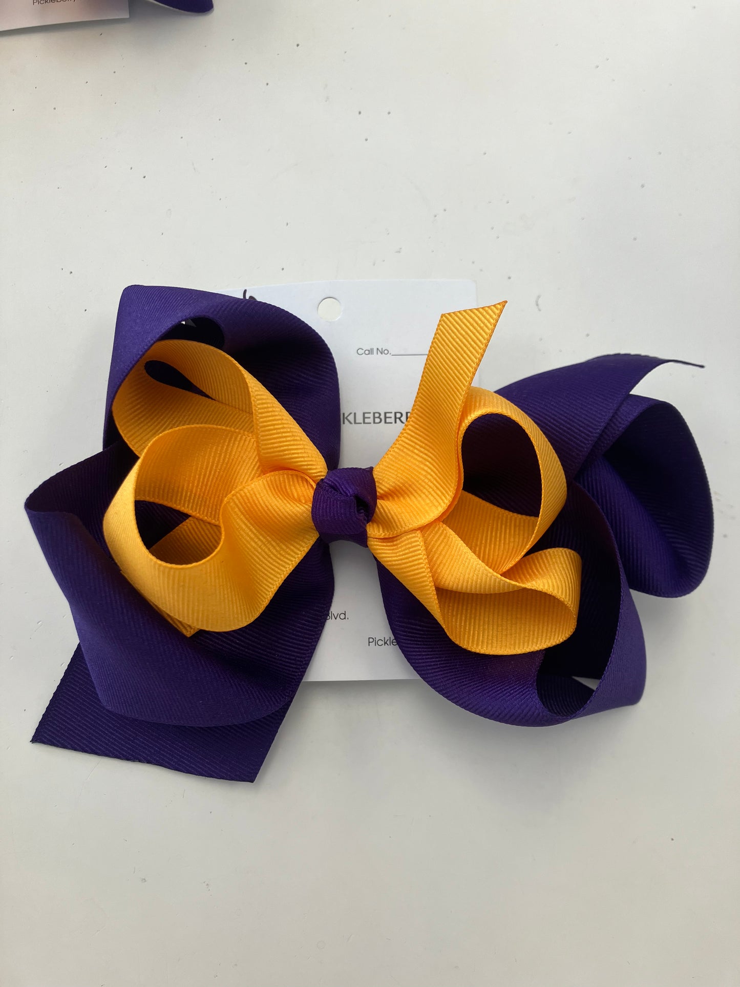 Purple and gold bow